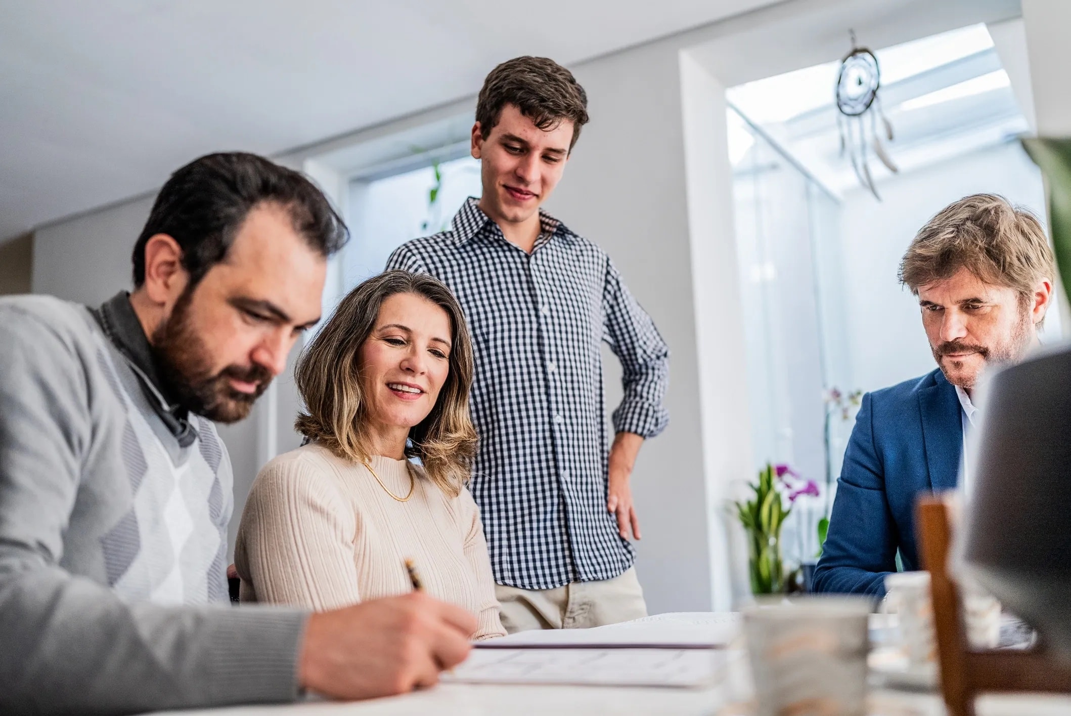 Family reviewing estate planning documents with advisor